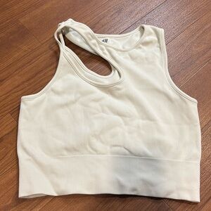 White asymmetrical cut crop top